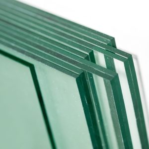 Sheets of Factory manufacturing tempered clear float glass panels cut to size Sheets of Factory manufacturing tempered clear float glass panels cut to size.