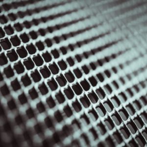 Metal background. Lattice texture with small cells grid. Selective focus point. Metal background. Lattice texture with small cells grid. Selective focus point